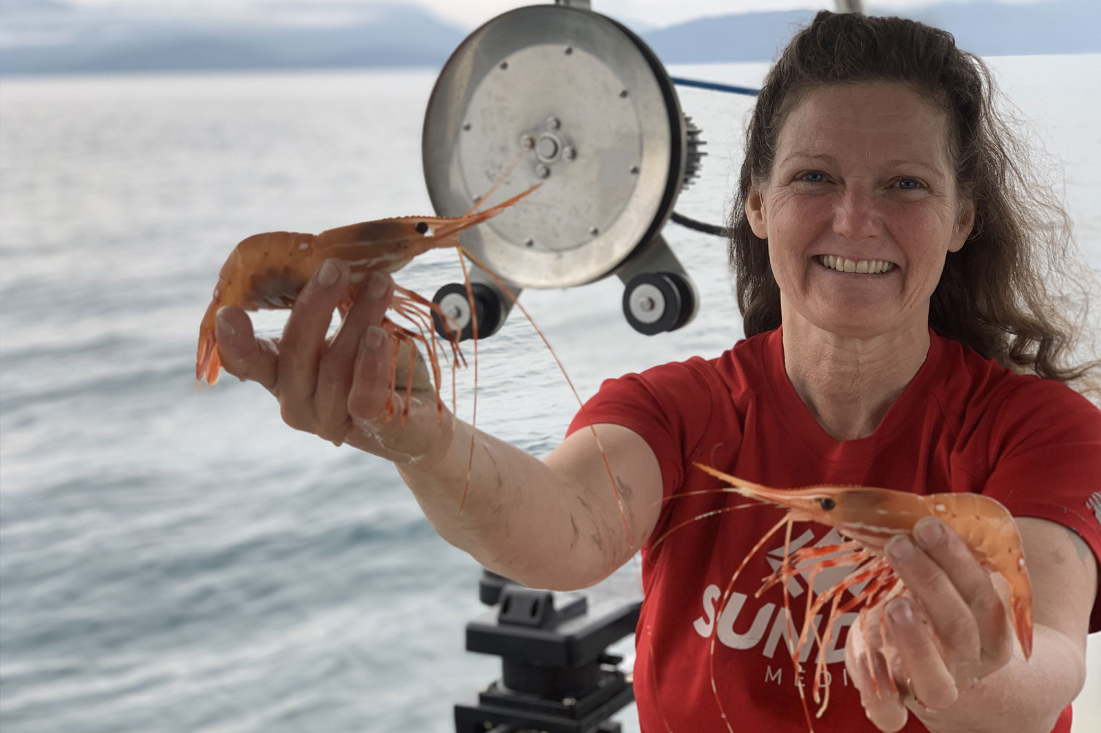 Cathy with shrimp out on the water