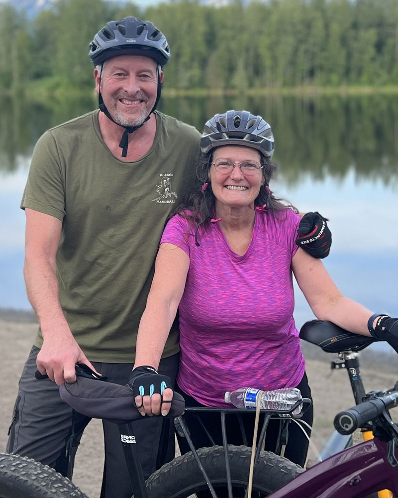 Joe and Cathy biking together