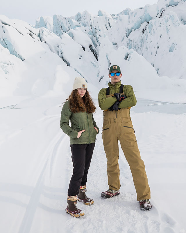 Jacob and his sister posing in front of a glacier